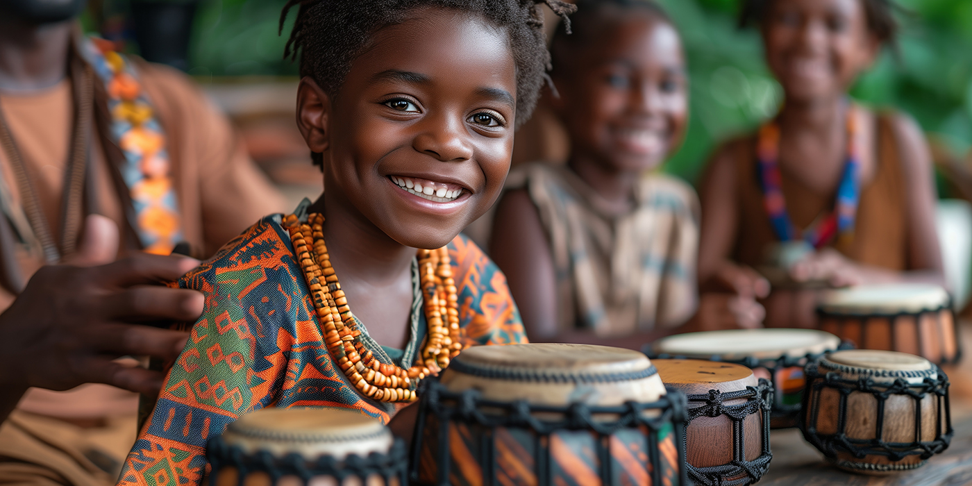 Young Boy Smiles While Playing Drums With Friends in Africa