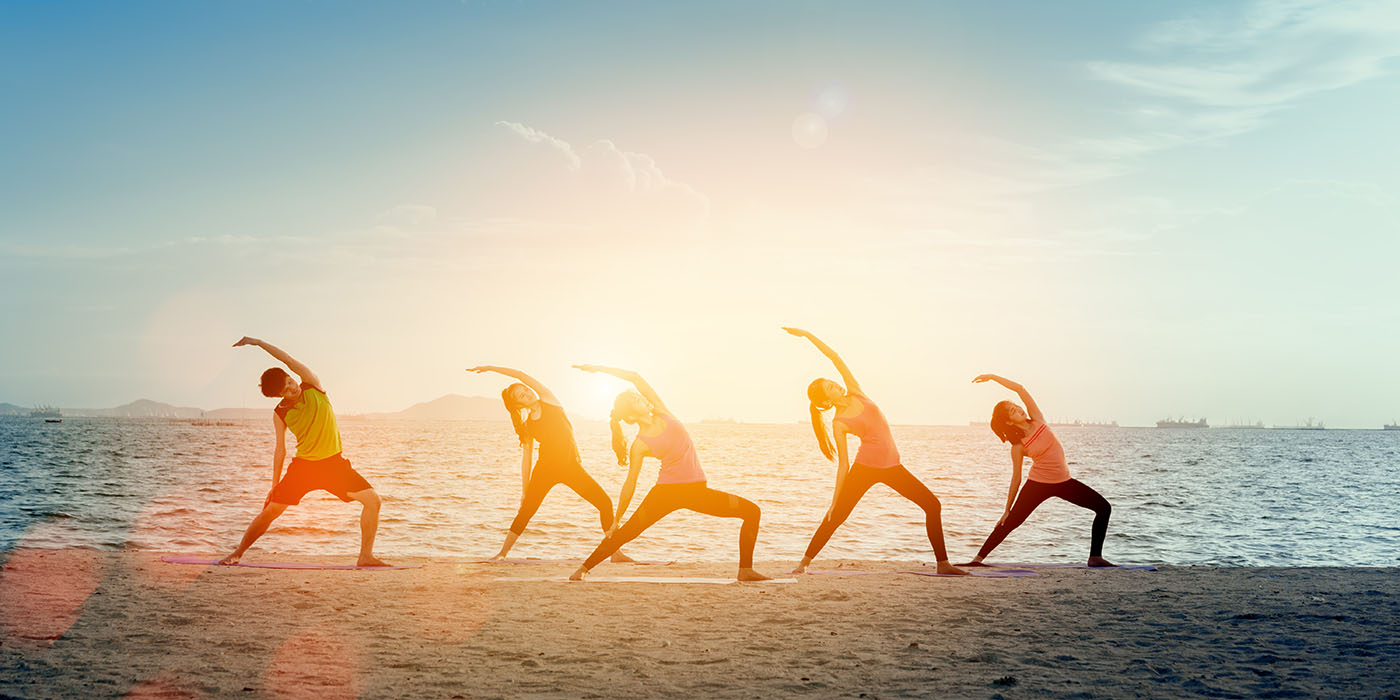 Young group man and woman yoga practice on mat relaxation in cla